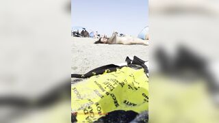 Bare girl playing in the sand?