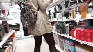 in a short skirt and stockings without underwear in the store