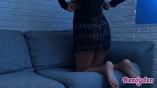 Yielding woman in a miniskirt spending the afternoon on her phone