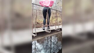 Latvian hotty jumps off a bridge into the river.