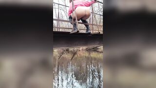 Latvian hotty jumps off a bridge into the river.