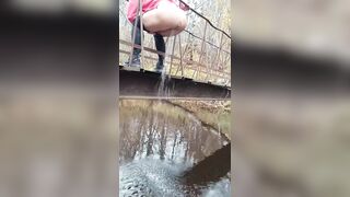 Latvian hotty jumps off a bridge into the river.