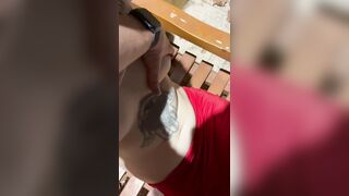 An Asian woman performs blowjob-job on a moaning dude outdoors.