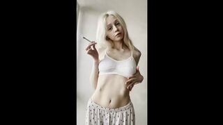 Flat stomach heaving as she blows smoke ?
