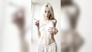 Flat stomach heaving as she blows smoke ?