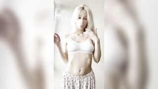 Flat stomach heaving as she blows smoke ?