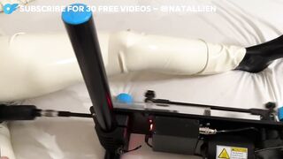 Latex female-dominator takes fuck machine then pegs her sub hard