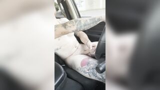 Athletic dude masturbating while driving