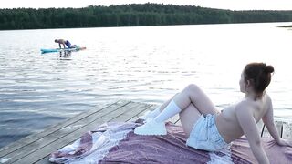 two girls took their raiment off on the lake. A passing surfer had sex in the open air.