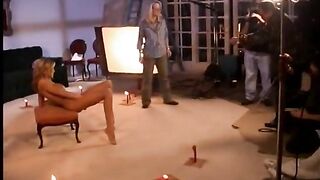 Behind the scenes footage of a camera crew filming a porn video