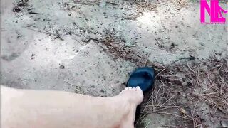 Avid Dangling in My Leather Black Flip Flops in a Park