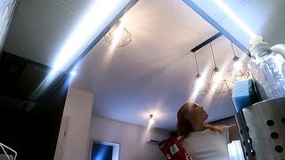 Hawt small real college gal in a plaid school uniform mini skirt flashes her legs and cotton panties in the kitchen