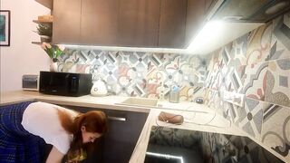 Hawt small real college gal in a plaid school uniform mini skirt flashes her legs and cotton panties in the kitchen
