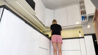 Hot hot golden-haired girl in pajama shorts in the kitchen wants to flash her snatch no panties under her pyjama