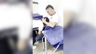 A young 18-year-old hotty giving head to her friend in the classroom.