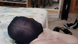 Stockings on the girlfriend's head and a portion of sperm on 'em