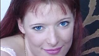 Sexy redhead teen is playing with her nipples