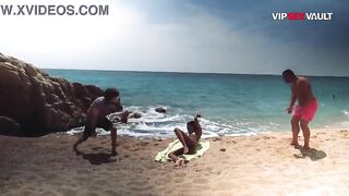 Topless Ebony Girl Gets Her Ass Stroked by two Men on the Sand