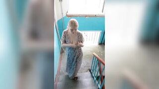 I'm a slutty wife stripping in the stairwell of an apartment building!