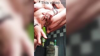 Granny bangs bushy cunt with cucumber