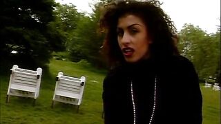 Classy brunette hottie gives an outdoor interview