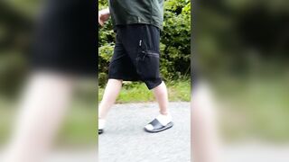 In slippers and white socks in nature