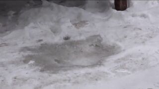 girl with hairy pussy, pissing on the street. back view