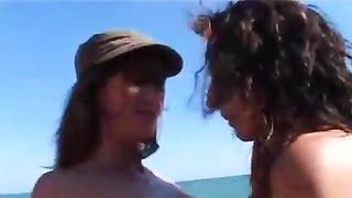 A Lesbian Threesome On The Beach