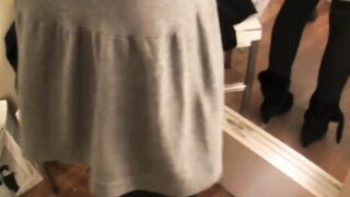 Two lesbians with big strap-on in the fitting room