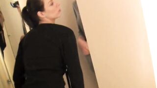 Two lesbians with big strap-on in the fitting room