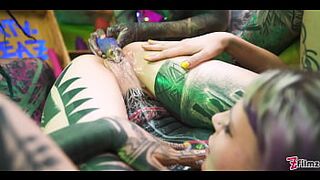 Tattooed beauty gets her ass filled with cum, compliment of goth lesbians
