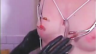 Skinny redhead girl is used as a sex toy by mature women in latex outfits