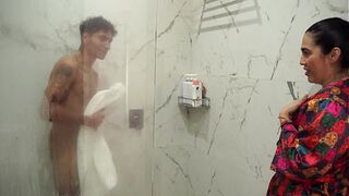 Big-assed stepmom ends up screwing her skinny stepson after spying on him in the shower