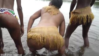 Raw documentary footages with 3 African tribe beauties dancing in the river in the forrest
