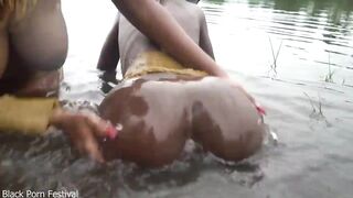 Raw documentary footages with 3 African tribe beauties dancing in the river in the forrest