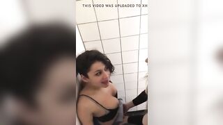 Two lesbians in night club bathroom