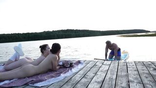 two Angels Took Their Garments off on the Lake. a Passing Surfer Had Sex in the Open Air
