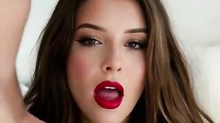 a woman with a bad mouth and red lipstick gives a oral job