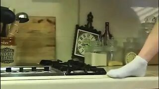 Hot cheerleader sucking penis in kitchen