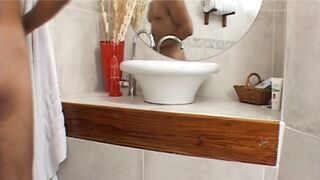 Busty golden-haired MILF wearing lingerie gets fucked and jizzed on titties in the bathroom