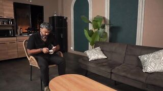 Busty Stepmother Plays with Her Stepson's Weenie While Her Husband Plays on His Game Console