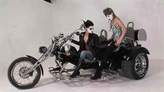 Lesbian Moto Riders with Painted Faces Licking Vagina and Playing with a Sex-toy