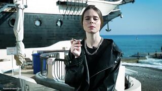 Young Russian Woman Smokin' Cigarette Outdoor Terrace