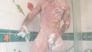 Athletic tattooed stud takes hot shower after the gym