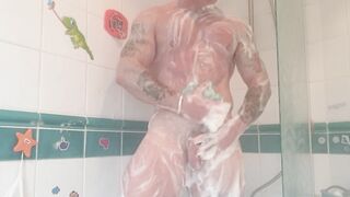 Athletic tattooed stud takes hot shower after the gym