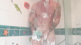 Athletic tattooed stud takes hot shower after the gym