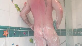 Athletic tattooed stud takes hot shower after the gym