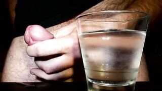 Closeup Thick Cumshot Into a Glass of Cold Water
