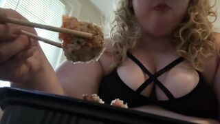 Overweight floozy eats sushi