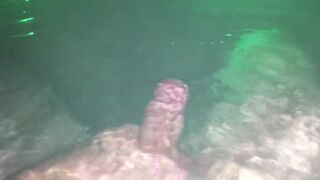 Underwater jack off session in backyard in steamy hawt tub glowing at night.